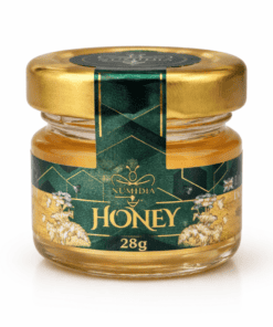 Numidia 28g mini jar of premium British honey displayed on a clean white background with gold lid and green floral label.