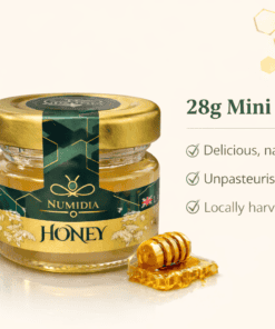 Numidia 28g unpasteurised honey mini jar displayed with floral gold design, product highlights, and a clean cream background.