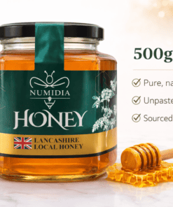 Numidia 500g Lancashire Local Honey jar with floral accents, honey dipper, and product benefits displayed on a clean promotional background.