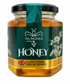 Close-up of Numidia Lancashire Local Honey 500g – premium British honey in luxury glass jar with gold label